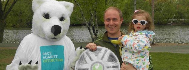 A man in a polar bear costume greets the children